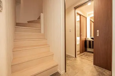a hallway with wooden stairs in a house at KTV Party House 3min to Itabashi Station Traditional Street Stay in Tokyo