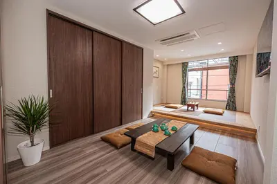 a living room with a couch and a table at KTV Party House 3min to Itabashi Station Traditional Street Stay in Tokyo