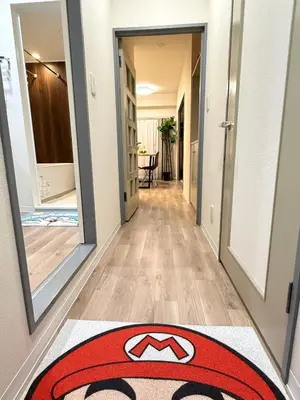 a hallway with a red carpet on the floor at Moto Sakura 502,Asakusa Ueno Great location 2 bedrooms,3 beds,6 Direct access to Narita and Haneda Airports,5 train lines available in Tokyo