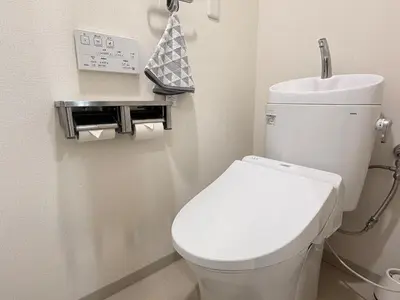 a bathroom with a white toilet in a room at Moto Sakura 502,Asakusa Ueno Great location 2 bedrooms,3 beds,6 Direct access to Narita and Haneda Airports,5 train lines available in Tokyo