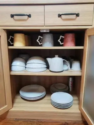 a cabinet filled with plates and bowls and dishes at LY-shinjuku-house SJ0432 in Tokyo