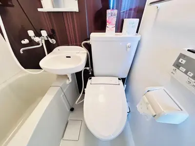 a bathroom with a toilet and a sink at LY-shinjuku-house SJ0432 in Tokyo