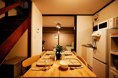 a table in a small room with a kitchen at Kotori Hinoki in Tokyo
