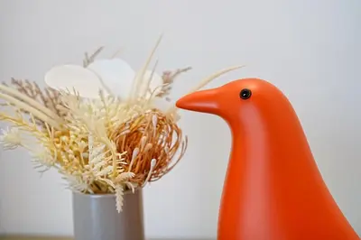 a toy rubber duck next to a vase of flowers at Kotori Hinoki in Tokyo
