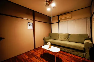 a living room with a couch and a table at Kotori Hinoki in Tokyo