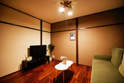 a living room with a couch and a tv at Kotori Hinoki in Tokyo