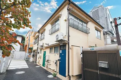 an apartment building with a gate and a fence at Kotori Akasaka in Tokyo