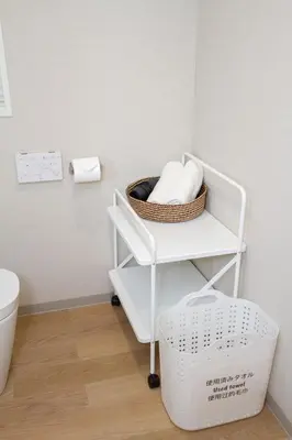 a bathroom with a basket of towels on a shelf at M House 301 Tokyo Omori\u99c5 in Tokyo
