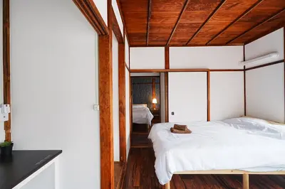 a bedroom with a white bed with a wooden ceiling at Monthly Only Kotori Hinoki Ideal Place for Long-term Stay and Workcation in Tokyo