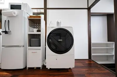 a white refrigerator with a dryer in a room at Monthly Only Kotori Hinoki Ideal Place for Long-term Stay and Workcation in Tokyo
