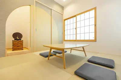 a dining room with a table and a window at TaroTime Shinjuku Serene Japanese Cottage in Tokyo