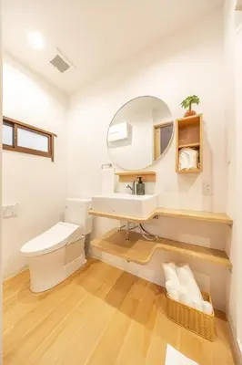 a bathroom with a sink and a mirror at TaroTime Shinjuku Serene Japanese Cottage in Tokyo