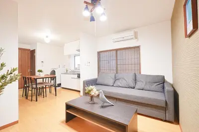 a living room with a couch and a table at Monthly Only Kotori Akasaka Ideal Place for Long-term Stay and Workcation in Tokyo