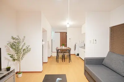 a living room with a couch and a table at Monthly Only Kotori Akasaka Ideal Place for Long-term Stay and Workcation in Tokyo