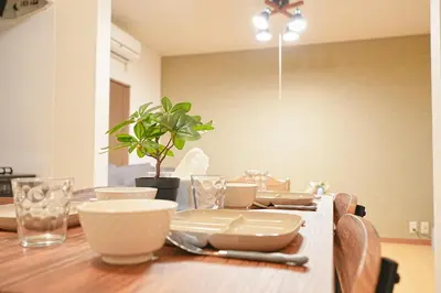 a dining room table with plates and dishes on it at Monthly Only Kotori Akasaka Ideal Place for Long-term Stay and Workcation in Tokyo