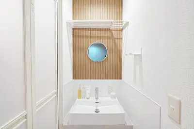 a bathroom with a sink and a mirror at Monthly Only Kotori Akasaka Ideal Place for Long-term Stay and Workcation in Tokyo