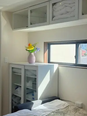 a bedroom with a vase of flowers on a counter at Minamikoiwa, Edogawa City -3F-EG0477 in Tokyo
