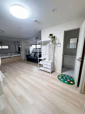 a living room with a couch and a room with a floor at Minamikoiwa, Edogawa City -3F-EG0477 in Tokyo