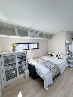 a bedroom with a large bed and a window at Minamikoiwa, Edogawa City -3F-EG0477 in Tokyo
