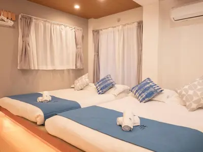 two beds with stuffed animals on them in a room at \u685c\u306e\u5ddd71 \u521d\u53f0\u99c55\u5206 2-6\u4eba\u4e285 minute from Hatsudai 2-6 people in Tokyo