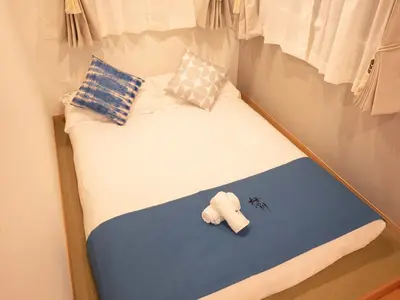 a small bed with a teddy bear sitting on it at \u685c\u306e\u5ddd71 \u521d\u53f0\u99c55\u5206 2-6\u4eba\u4e285 minute from Hatsudai 2-6 people in Tokyo