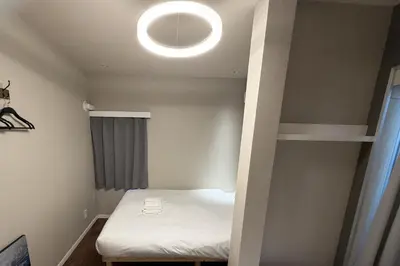 a small room with a bunk bed and a light at AHAI \u30db\u30c6\u30eb2 - Tokyo Private VILLA in Tokyo