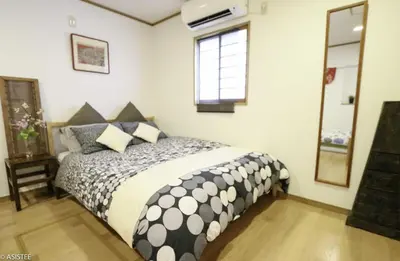a bedroom with a bed and a window at Corpo HARU 101 - Vacation STAY 23522v in Tokyo