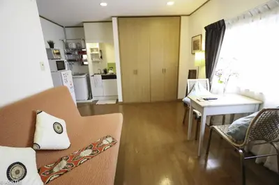 a living room with a couch and a table at Corpo HARU 101 - Vacation STAY 23522v in Tokyo