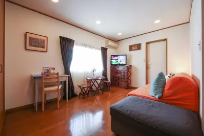 a bedroom with a bed and a table and a desk at Corpo HARU 101 - Vacation STAY 23522v in Tokyo