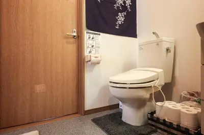 a bathroom with a toilet and a door at Corpo HARU 101 - Vacation STAY 23522v in Tokyo