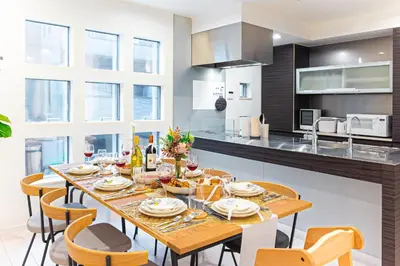 a dining room with a table and chairs in a kitchen at STARRY STAY HOUSE SHIBUYA I - Vacation STAY 65376v in Tokyo