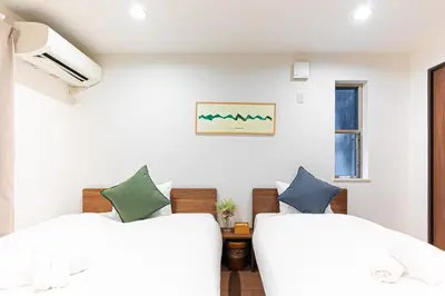 a bedroom with two beds and a window at STARRY STAY HOUSE SHIBUYA I - Vacation STAY 65376v in Tokyo