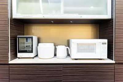 a kitchen with three appliances sitting on a shelf at STARRY STAY HOUSE SHIBUYA I - Vacation STAY 65376v in Tokyo