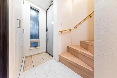 a hallway with stairs in a home with a window at STARRY STAY HOUSE SHIBUYA I - Vacation STAY 65376v in Tokyo