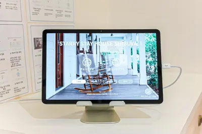 a computer monitor sitting on top of a desk at STARRY STAY HOUSE SHIBUYA I - Vacation STAY 65376v in Tokyo
