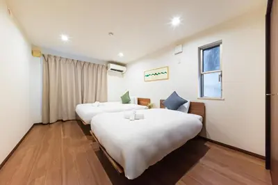 a hotel room with two beds and a window at STARRY STAY HOUSE SHIBUYA I - Vacation STAY 65376v in Tokyo