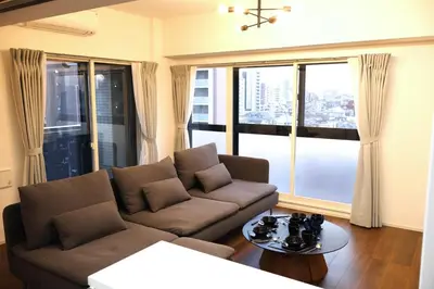 a living room with a couch and a table at Room 101 - Vacation STAY 82278v in Tokyo
