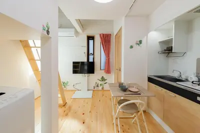 a small kitchen with a table and a small dining room at Zenith Shinjuku-Hunoki- - Vacation STAY 82833v in Tokyo