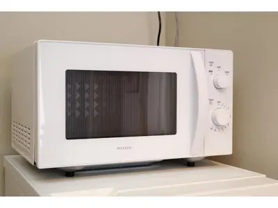 a microwave oven sitting on top of a shelf at Living Stay Plum Residence - Vacation STAY 20585 in Tokyo