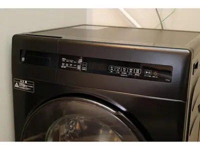 a black microwave oven with a washing machine at Living Stay Plum Residence - Vacation STAY 20585 in Tokyo