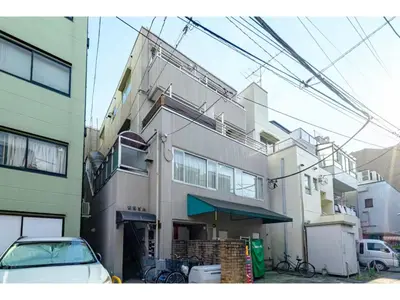a building with a car parked in front of it at Living Stay Plum Residence - Vacation STAY 20586 in Tokyo