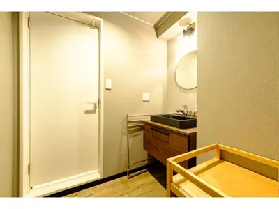 a bathroom with a sink and a mirror at Living Stay Plum Residence - Vacation STAY 20586 in Tokyo