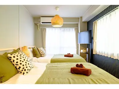 a hotel room with two beds with towels on them at Living Stay Plum Residence - Vacation STAY 20584 in Tokyo