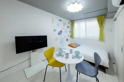 a small white room with a table and chairs at Reco Waseda - Vacation STAY 20613 in Tokyo