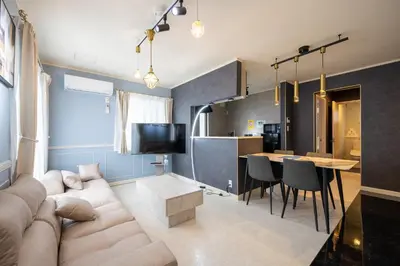 a living room with a couch and a table at Familia Heiwajima 2 in Tokyo