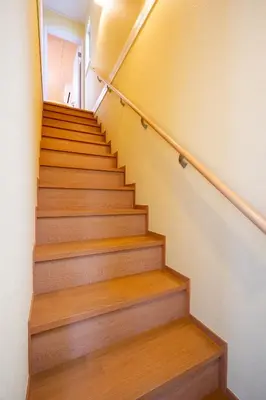 a staircase in a house with wooden floors at Familia Heiwajima 2 in Tokyo