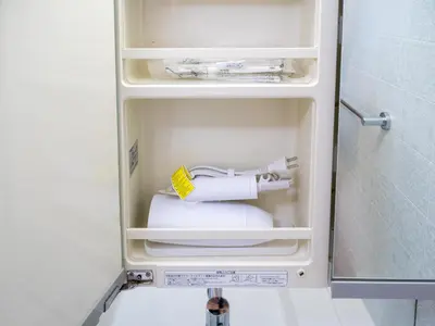 a small refrigerator with a toilet in it at Familia Heiwajima 2 in Tokyo