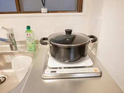 a pot on top of a stove in a kitchen at \u685c\u306e\u5ddd72 \u521d\u53f0\u99c55\u5206 2-4\u4eba\u4e285 minute from Hatsudai 2-4 people in Tokyo