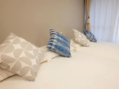 a group of pillows sitting on top of a bed at \u685c\u306e\u5ddd72 \u521d\u53f0\u99c55\u5206 2-4\u4eba\u4e285 minute from Hatsudai 2-4 people in Tokyo