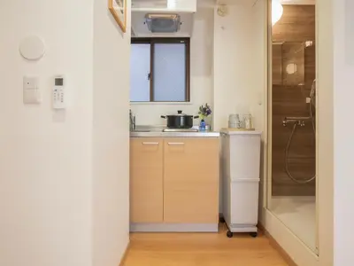 a small kitchen with a sink and a window at \u685c\u306e\u5ddd73 \u521d\u53f0\u99c55\u5206 2-4\u4eba\u4e285 minute from Hatsudai 2-4 people in Tokyo